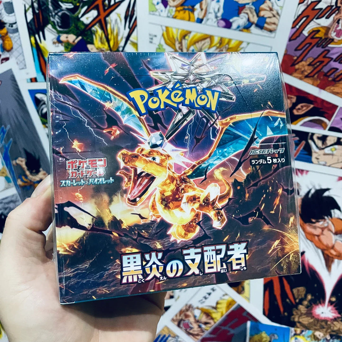 a japanese booster box with a charizard displayed